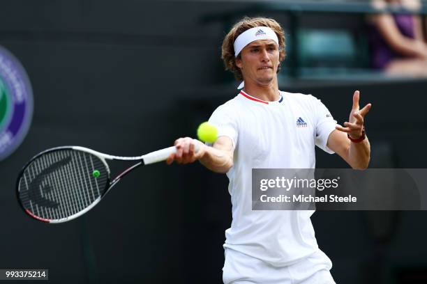 Alexander Zverev of Germany returns against Ernests Gulbis of Latvia during their Men's Singles third round match on day six of the Wimbledon Lawn...