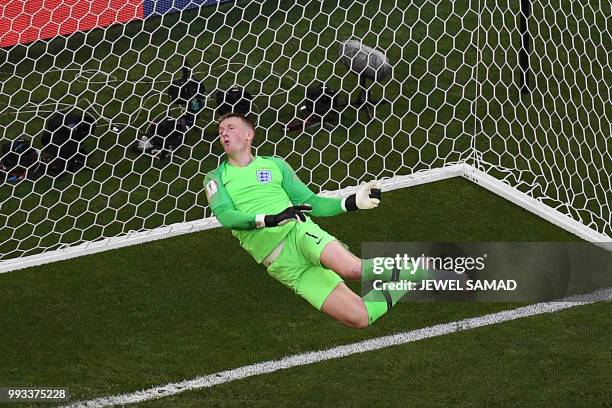 England's goalkeeper Jordan Pickford deflects the ball over the bar during the Russia 2018 World Cup quarter-final football match between Sweden and...