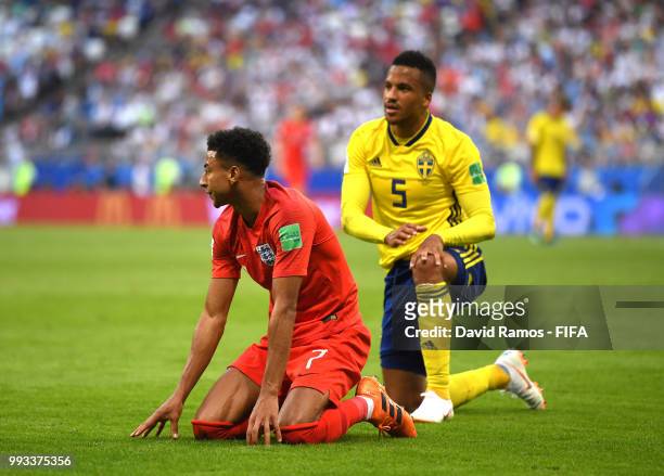 Jesse Lingard of England and Martin Olsson of Sweden look on during the 2018 FIFA World Cup Russia Quarter Final match between Sweden and England at...