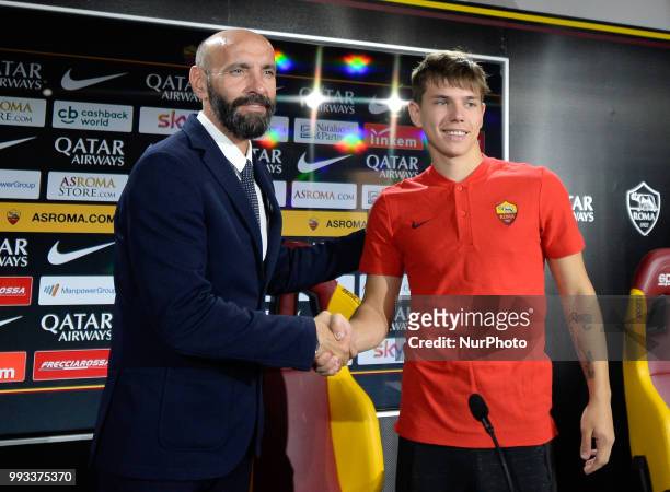 New signing Ante Coric and Sport Director Ramon Rodriguez Verdejo Monchi pose for photographers during the press conference at the AS Roma Training...