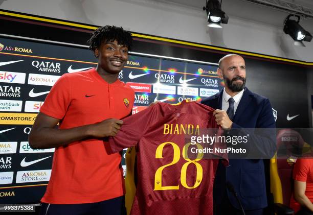 New signing William Bianda and Sport Director Ramon Rodriguez Verdejo Monchi pose for photographers with AS Roma Shirt during the press conference at...
