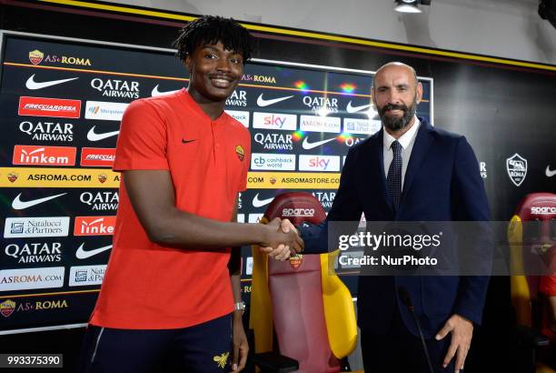 New signing William Bianda and Sport Director Ramon Rodriguez Verdejo Monchi pose for photographers during the press conference at the AS Roma...