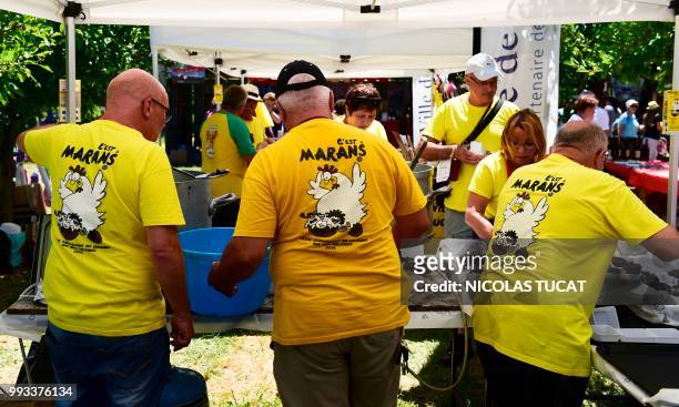 People attend the annual meeting of French towns and villages with odd-sounding names on July 7, 2018 in Monteton, southwestern France.