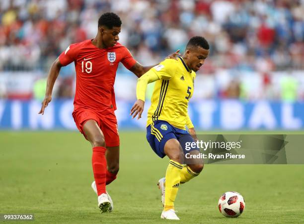 Martin Olsson of Sweden is challenged by Marcus Rashford of England during the 2018 FIFA World Cup Russia Quarter Final match between Sweden and...