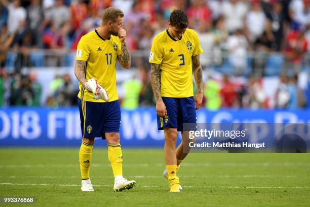 John Guidetti and Victor Lindelof of Sweden show their dejection following the 2018 FIFA World Cup Russia Quarter Final match between Sweden and...