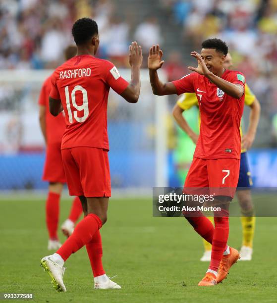 Marcus Rashford and Jesse Lingard of England celebrate following their sides victory in the 2018 FIFA World Cup Russia Quarter Final match between...