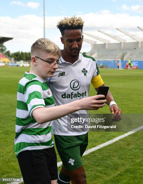 Dublin , Ireland - 7 July 2018; A young fan takes a selfie with Scott Sinclair of Celtic following the friendly match between Shamrock Rovers and...