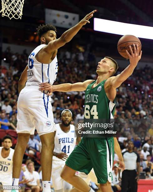 Jarrod Uthoff of the Boston Celtics shoots against Jonah Bolden of the Philadelphia 76ers during the 2018 NBA Summer League at the Thomas & Mack...