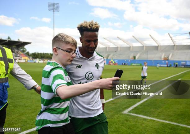 Dublin , Ireland - 7 July 2018; A young fan takes a selfie with Scott Sinclair of Celtic following the friendly match between Shamrock Rovers and...