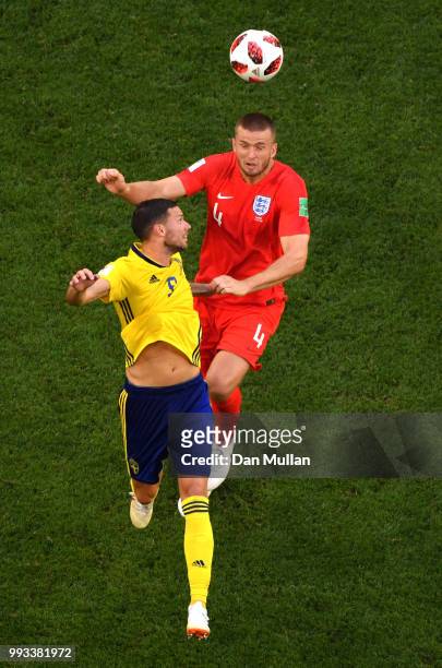 Eric Dier of England wins a header over Marcus Berg of Sweden during the 2018 FIFA World Cup Russia Quarter Final match between Sweden and England at...