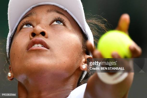 Japan's Naomi Osaka prepares to serve against Germany's Angelique Kerber during their women's singles third round match on the sixth day of the 2018...
