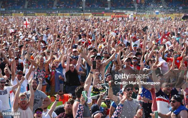 Fans watch the England vs Sweden World Cup match after qualifying for the Formula One Grand Prix of Great Britain at Silverstone on July 7, 2018 in...