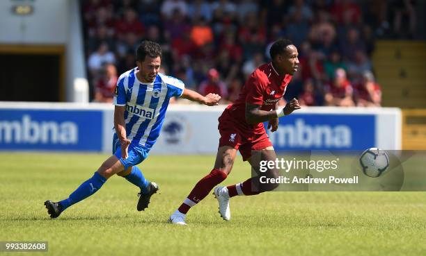 Nathaniel Clyne of Liverpool competes with John Pritchard Chester FC during the Pre-season friendly between Chester FC and Liverpool on July 7, 2018...