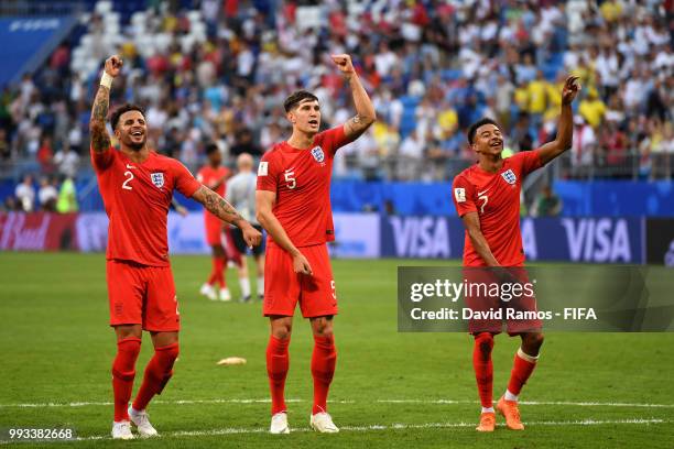 Kyle Walker, John Stones, and Jesse Lingard of England celebrate following their sides victory in the 2018 FIFA World Cup Russia Quarter Final match...