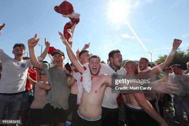 England fans celebrate at full time as England win 2-0 against Sweden in the World Cup quarter finals at Ashton Gate World Cup fans village at the...