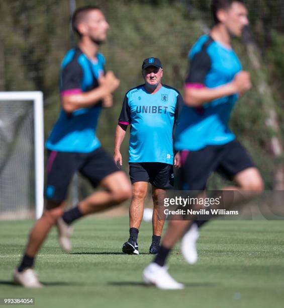 Steve Bruce manager of Aston Villa watches his team during an Aston Villa training session at the club's training camp on July 07, 2018 in Faro,...