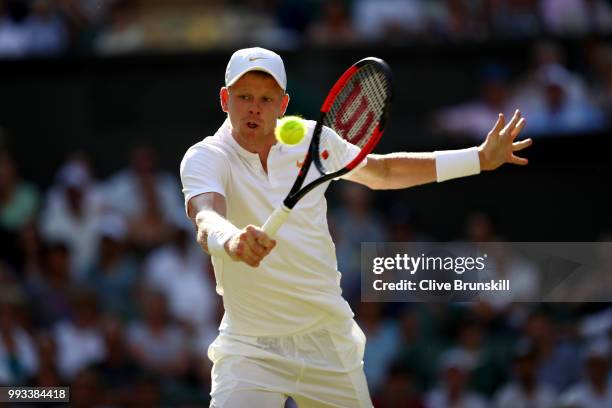 Kyle Edmund of Great Britain returns a shot against Novak Djokovic of Serbia during their Men's Singles third round match on day six of the Wimbledon...