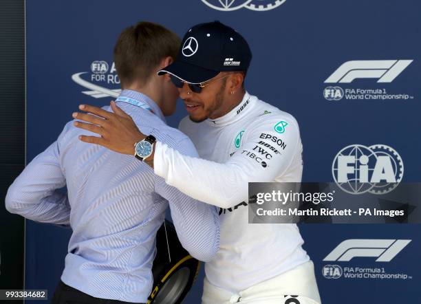 Merecede's Lewis Hamilton and british racing driver Billy Monger after qualifying ahead of the 2018 British Grand Prix at Silverstone Circuit,...