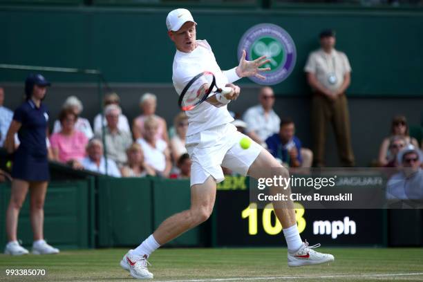 Kyle Edmund of Great Britain returns a shot against Novak Djokovic of Serbia during their Men's Singles third round match on day six of the Wimbledon...