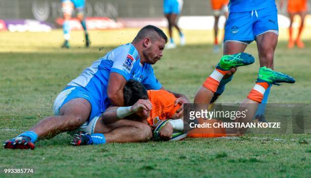 South Africa's Bulls hooker Jaco Visagie fails to prevent Argentina's Jaguares scrum-half Gonzalo Bertranou from scoring his second try during the...