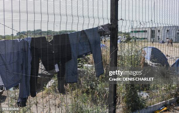 Picture taken on July 7, 2018 shows in Calais. - Several hundred people took part in a "solidarity" march in support of migrants in Calais, organised...