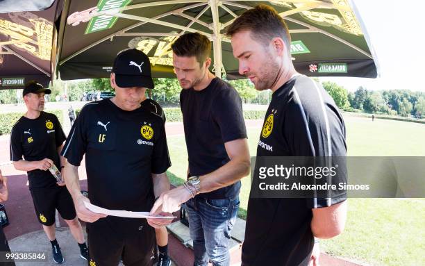 Manager Lucien Favre and Sebastian Kehl , m., with physiotherapist Thorben Voeste of Dortmund looks on during the Lactate Test at Dortmund on July 7,...