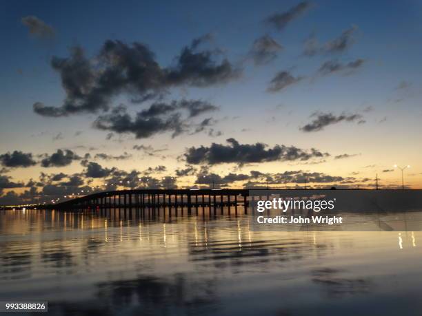 sunrise over the eau gallie causeway - eau stock-fotos und bilder