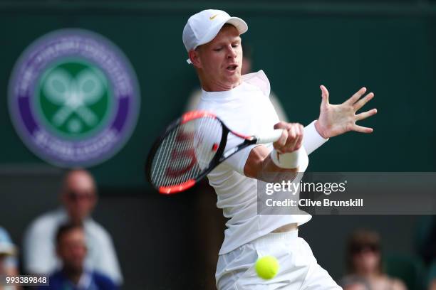 Kyle Edmund of Great Britain returns a shot against Novak Djokovic of Serbia during their Men's Singles third round match on day six of the Wimbledon...