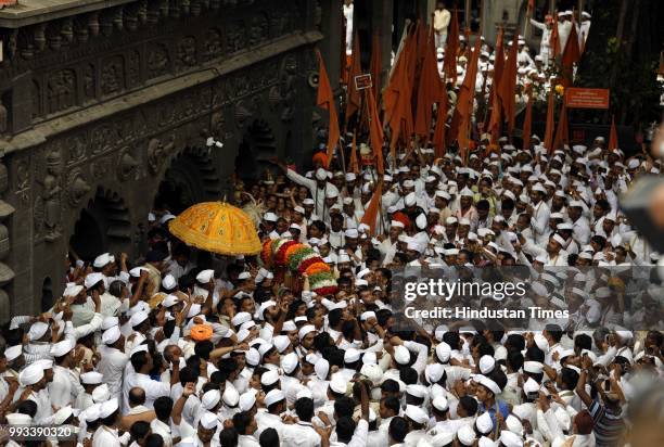 Devotees and pilgrims also known as warkaris gathered at Dnyaneshwar's shrine in Alandi for annual pilgrimage to the Vitthala temple in Pandharpur on...