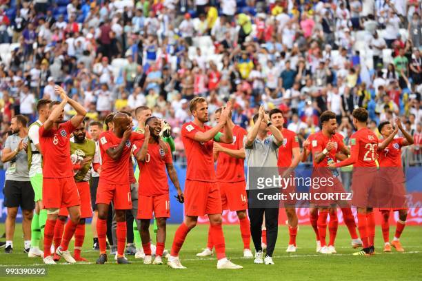 England's players celebrate at the end of the Russia 2018 World Cup quarter-final football match between Sweden and England at the Samara Arena in...