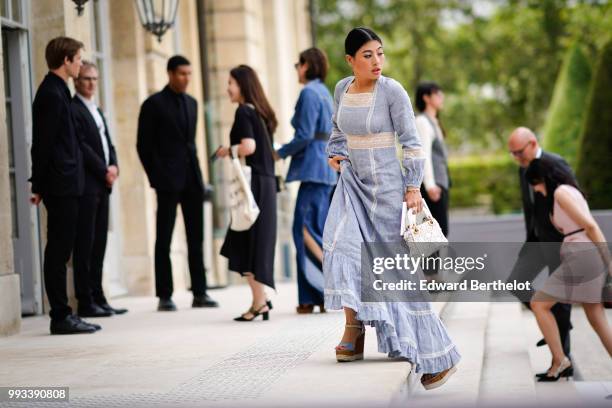 Sirivannavari Nariratana, princess of Thailand, wears a blue dress, outside Dior, during Paris Fashion Week Haute Couture Fall Winter 2018/2019, on...