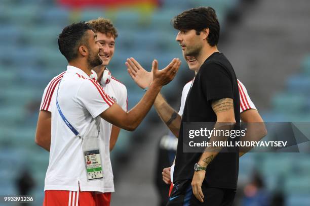 Russia's midfielder Alexander Samedov shakes hands with Croatia's defender Vedran Corluka during the pitch inspection before the Russia 2018 World...