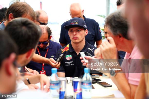Max Verstappen of Netherlands and Red Bull Racing talks to the media after qualifying for the Formula One Grand Prix of Great Britain at Silverstone...