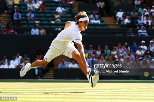 Alexander Zverev of Germany returns a shot against Ernests Gulbis of Latvia during their Men's Singles third round match on day six of the Wimbledon...