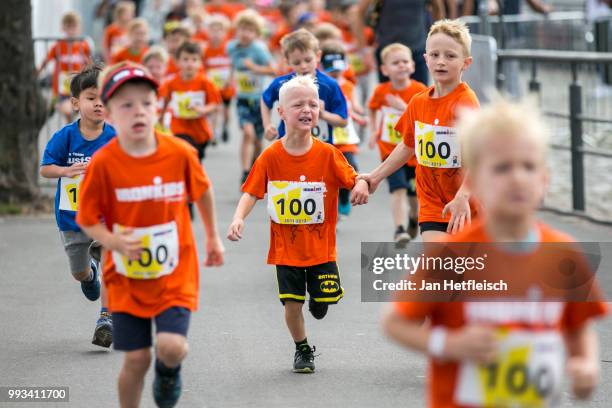 Children compete during the IRONKIDS run ahead the Mainova IRONMAN European Championship on July 7, 2018 in Frankfurt am Main, Germany.