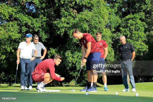 Philip Golding of England, Jarmo Sandelin of Sweden, Paul Eales of England, Jordan Hugill, Mark Noble and Aaron Cresswell of West Ham United gather...