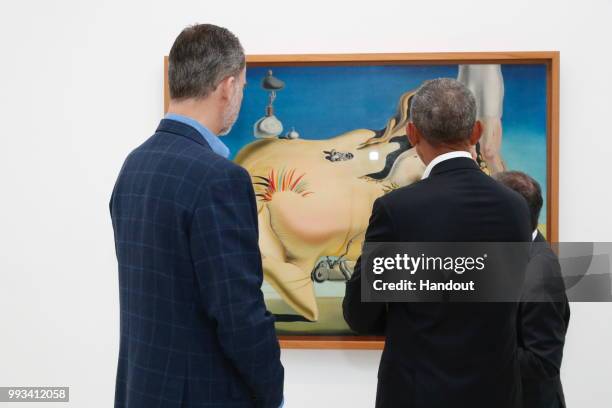 In this handout from the Casa Real - King Felipe VI of Spain and former President Barack Obama visit Reina Sofia museum on July 7, 2018 in Madrid,...