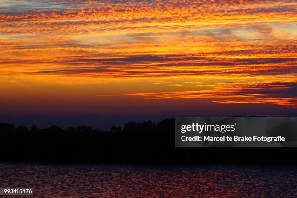 dutch sunset - fotografie ストックフォトと画像