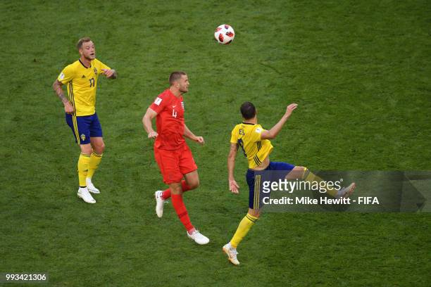 Eric Dier of England wins a header under pressure from John Guidetti of Sweden and Marcus Berg of Sweden during the 2018 FIFA World Cup Russia...