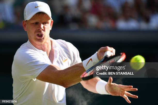 Britain's Kyle Edmund returns against Serbia's Novak Djokovic during their men's singles third round match on the sixth day of the 2018 Wimbledon...