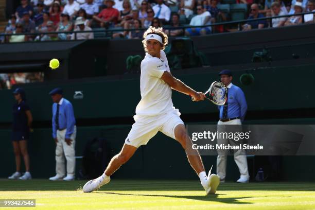 Alexander Zverev of Germany returns a shot against Ernests Gulbis of Latvia during their Men's Singles third round match on day six of the Wimbledon...