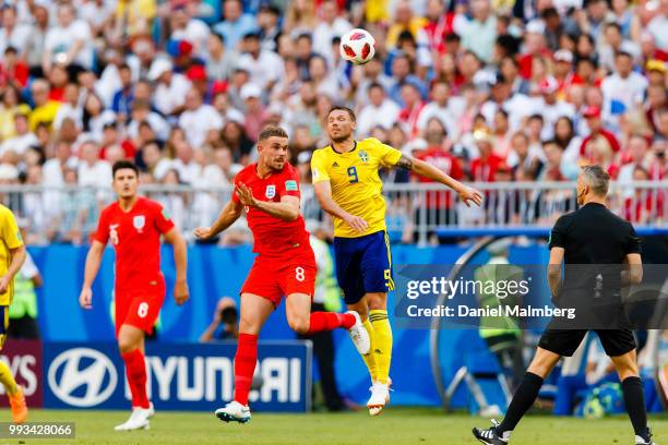 Jordan Henderson of England and Marcus Berg of Sweden in a header during the 2018 FIFA World Cup Russia Quarter Final match between Sweden and...