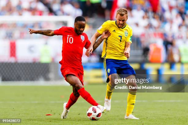 Raheem Sterling of England and Sebastian Larsson of Sweden battle for the ball during the 2018 FIFA World Cup Russia Quarter Final match between...