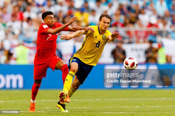 Jesse Lingard of England battle for the ball with Albin Ekdal of Sweden during the 2018 FIFA World Cup Russia Quarter Final match between Sweden and...