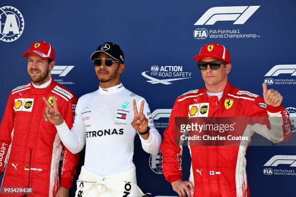 Top three qualifiers Lewis Hamilton of Great Britain and Mercedes GP, Sebastian Vettel of Germany and Ferrari, and Kimi Raikkonen of Finland and...