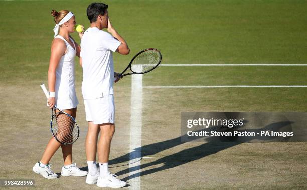 Anna Smith and Ken Skupski during the doubles on day six of the Wimbledon Championships at the All England Lawn Tennis and Croquet Club, Wimbledon.