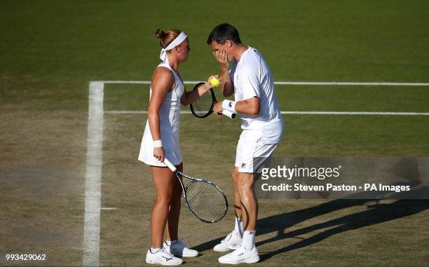 Anna Smith and Ken Skupski during the doubles on day six of the Wimbledon Championships at the All England Lawn Tennis and Croquet Club, Wimbledon.