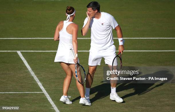 Anna Smith and Ken Skupski during the doubles on day six of the Wimbledon Championships at the All England Lawn Tennis and Croquet Club, Wimbledon.