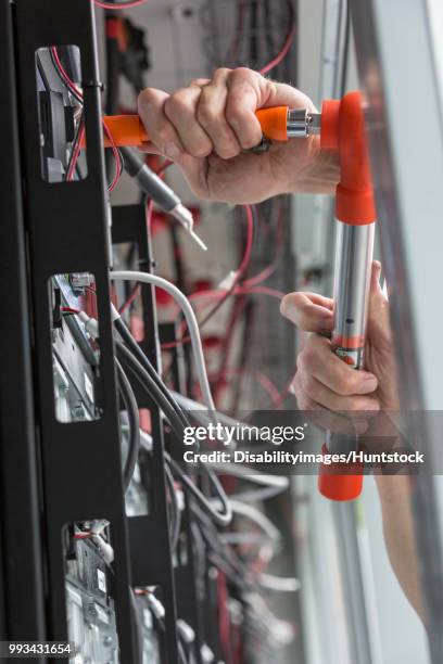 engineer using a torque wrench on copper bolts - torque wrench stock pictures, royalty-free photos & images