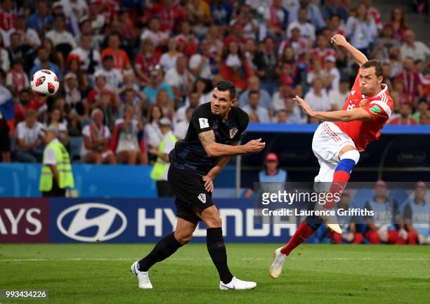 Artem Dzyuba of Russia shoots past Dejan Lovren of Croatia during the 2018 FIFA World Cup Russia Quarter Final match between Russia and Croatia at...